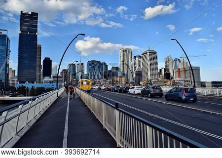 The Big Bridge Conecting City Beetwen River With Skyscraper In Background