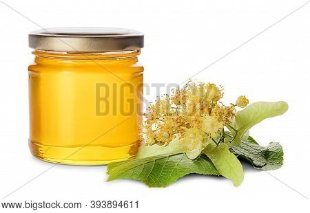 Glass Jar Of Sweet Honey And Linden Flowers With Leaves Isolated On White Background.