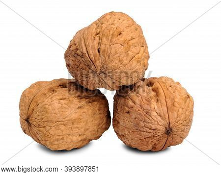 Close Up Of Three Hard Walnut Isolated On White Background.
