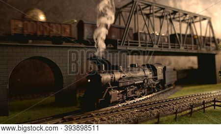Lokomotive With Steam Smoke. Retro Miniature Railway Model.