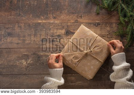 Christmas Gift. Congratulations.top View Of Woman Holding Traditional Decorated Gift Box. Hands Hold