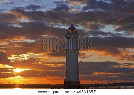 Lighthouse At Sunset
