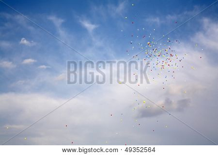 Varicoloured balloons fly on air on a background sky