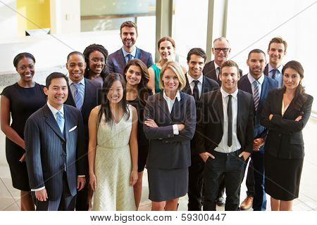 Portrait Of Multi-Cultural Office Staff Standing In Lobby