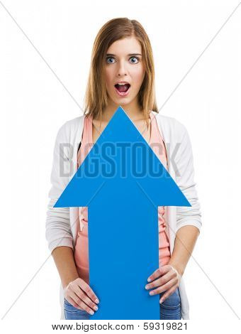 Astonished woman holding a blue arrow pointing up