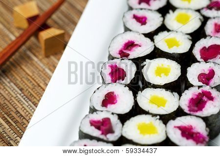 Large Plated Filled With Pickled Hand Rolled Sushi
