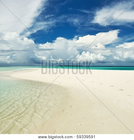 Beautiful island beach with sandspit at Maldives