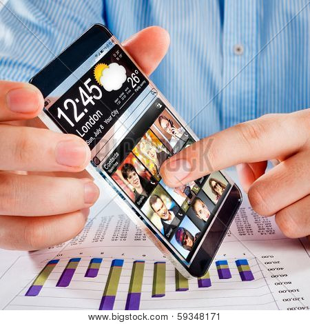 Smartphone (phablet) with a transparent display in human hands. Concept actual future innovative ideas and best technologies humanity.