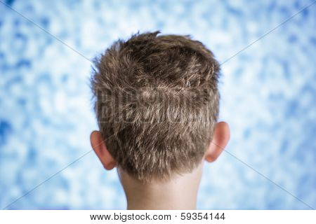 Boy watching television with noise