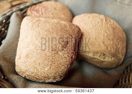 bread in basket - little roll breads in basket on table