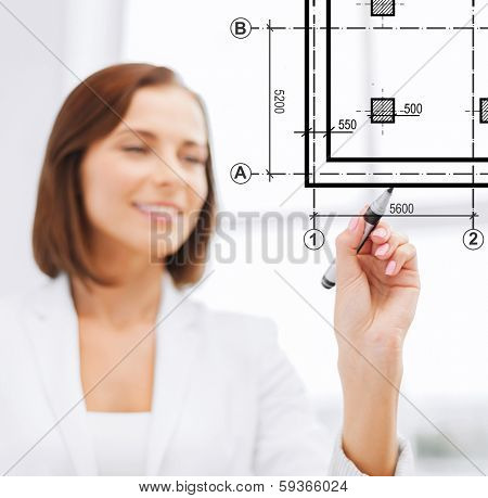 building, developing, consrtuction and architecture concept - female architect drawing blueprint on virtual screen