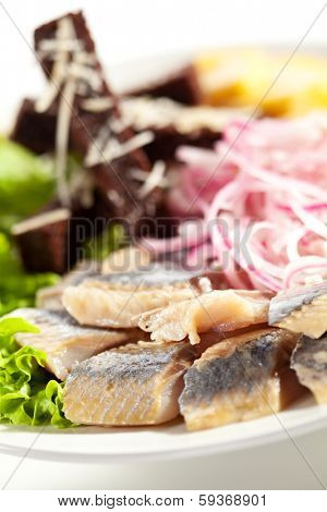 Herring Served with Potato, Onions and Bried Sticks