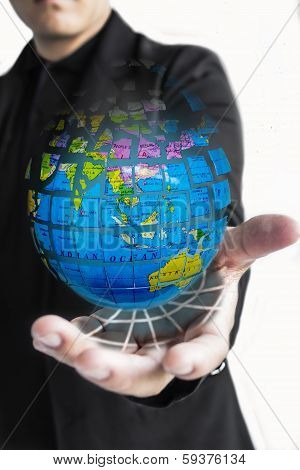 man holds Earth in a hand