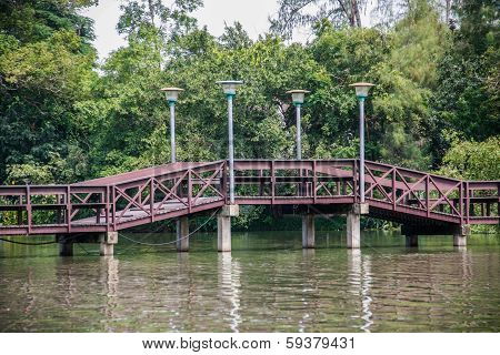 Wooden Bridge Over Pond
