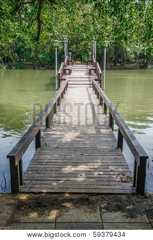 Wooden Bridge Over Pond