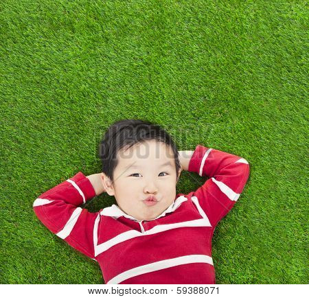 A Spoof Expression Kid Lying And Holding His Head