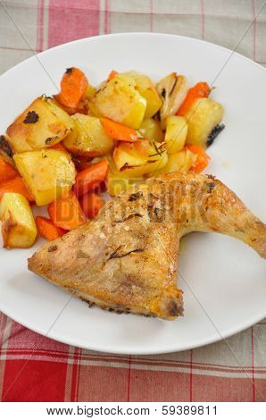 roast chicken leg with potatoes and pumpkin
