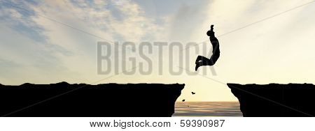 Concept or conceptual young man, businessman silhouette jump happy from cliff over water gap sunset or sunrise sky background, metaphor to freedom, nature, mountain, success, free, joy, health or risk