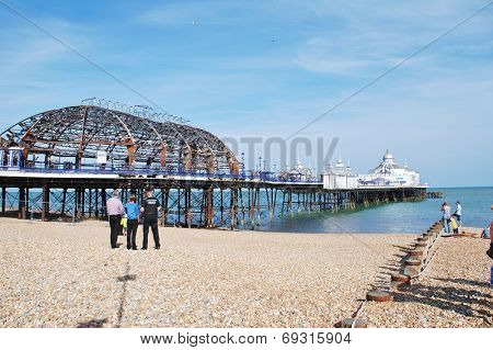 EASTBOURNE, ENGLAND - JULY 31, 2014: The historic Victorian pier after being badly damaged by fire on July 30, 2014. Designed by Eugenius Birch, the pier opened in 1870.