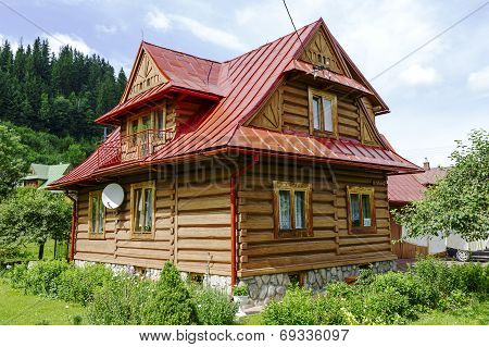 Traditional House Made Of Wooden Logs In Zakopane