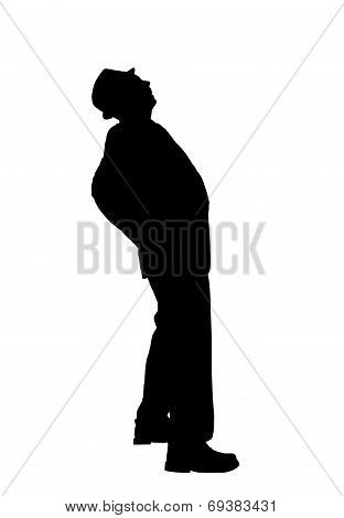 Silhouette of a Man Bending Over Backward to Look Up