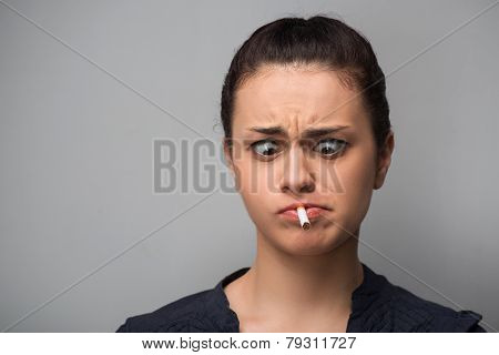 Addiction. Closeup of young woman determined girl holding cigare