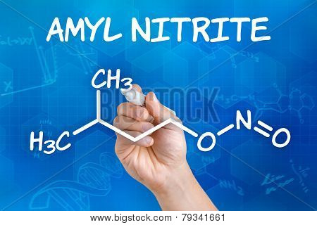 Hand with pen drawing the chemical formula of amyl nitrite