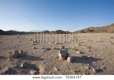 Rocky Desert Landscape With Mountains