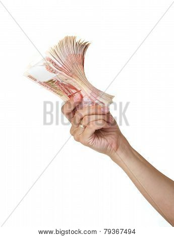 Stack of five thousandth bills in the female hand.