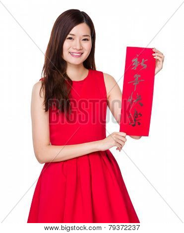 Asian woman hold with china Fai Chun, phrase meaning is happy new year 