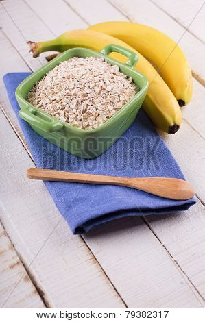 Oat Flakes In Bowl With Bananas