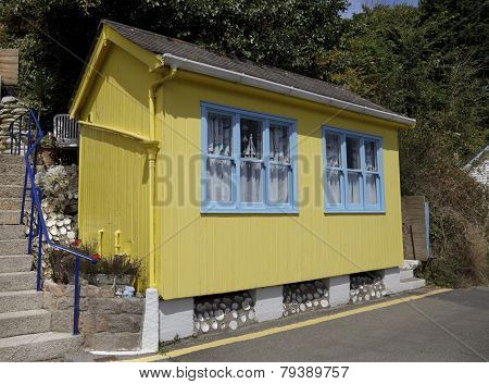 Small yellow and blue beach hut