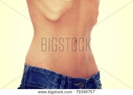 Belly of young female with anorexia.
