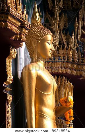 Standing Buddha Front Of Church On Thai Temple In Thailand.