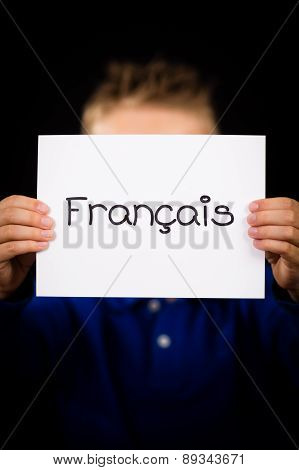 Child Holding Sign With French Word Francais - French