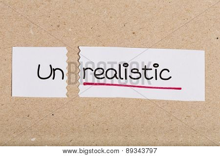 Sign With Word Unrealistic Turned Into Realistic