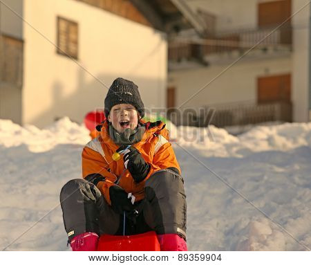 Young Boy  In The Winter Plays With Bob
