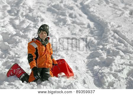 Cute Boy With Wool Cap In The Winter Plays With Bob In The Mountains