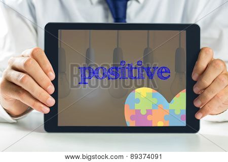 The word positive and autism awareness heart against second light bulb lighting