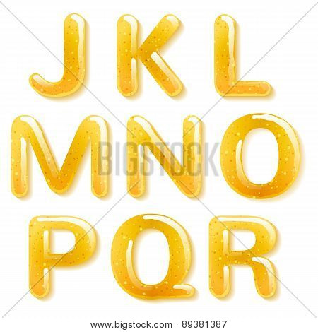 Yellow honey jelly alphabet. Glossy letters.