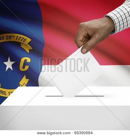 Voting Concept - Ballot Box With Us State Flag On Background - North Carolina