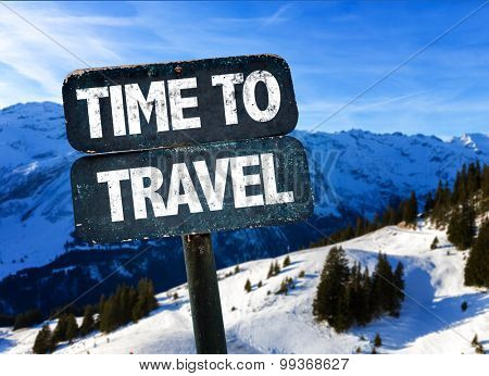 Time To Travel sign with alps on background