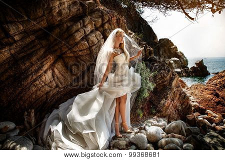 Sensual Woman In Wedding Dress Posing Outdoor.