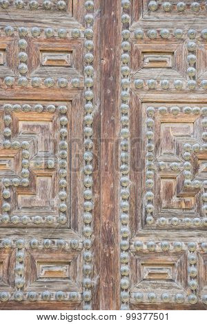 Vintage, old wooden door Castilian style in Toledo Spain