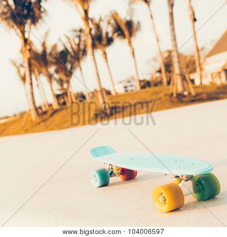 Light Blue Longboard Penny Board With Multicolored Wheels Ready For Extreme Outdoor Ride