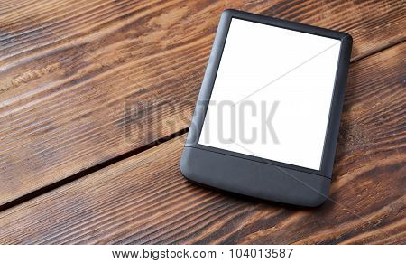 E-reader/tablet On Wood Table