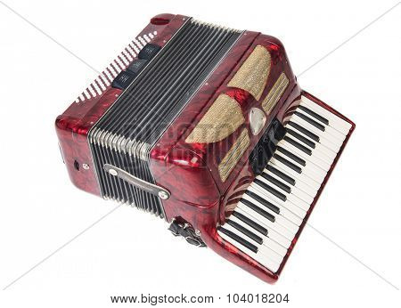Old red accordion isolated on a white background