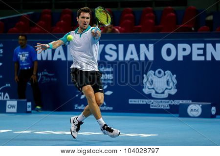 KUALA LUMPUR, MALAYSIA - SEPTEMBER 27, 2015: Mischa Zverev of Germany plays in his qualifying match at the Malaysian Open 2015 Tennis tournament held at the Putra Stadium, Malaysia.