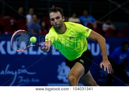 KUALA LUMPUR, MALAYSIA - SEPTEMBER 30, 2015: Ivo Karlovic of Croatia hits a forehand return in his match at the Malaysian Open 2015 Tennis tournament held at the Putra Stadium, Malaysia.