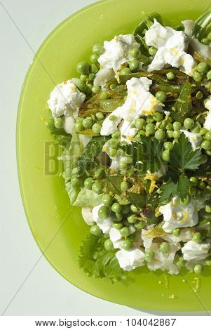 Salad with cream cheese and young peas